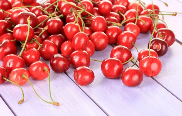 Cherry berries on wooden table — Stock Photo, Image