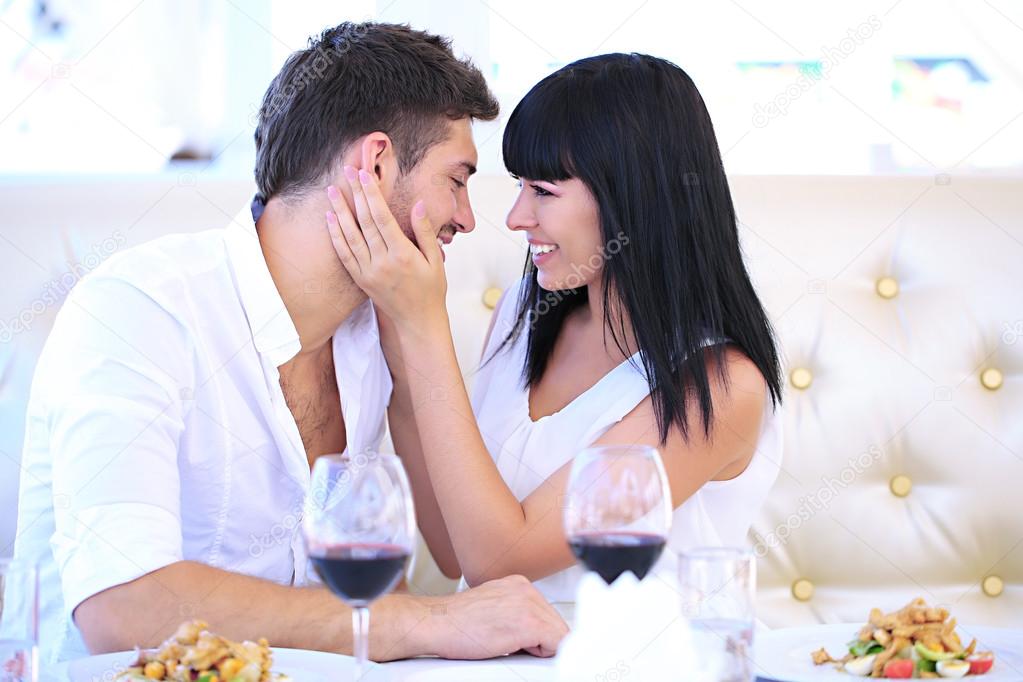 Beautiful couple having romantic dinner at restaurant