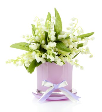 Beautiful lily of the valley in vase isolated on white clipart