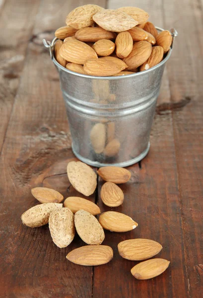 Almond on wooden background — Stock Photo, Image