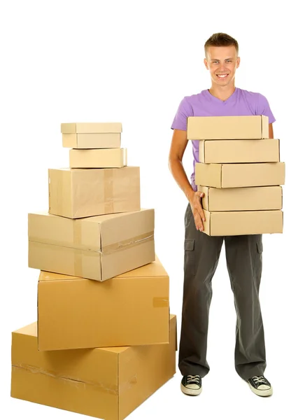 Young delivery man with parcels, isolated on white — Stock Photo, Image