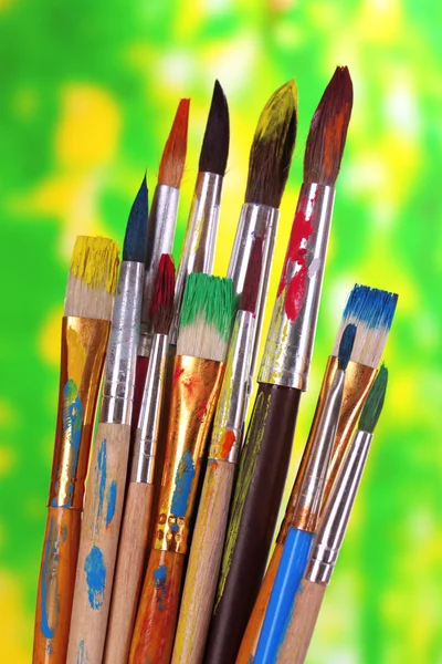 Many brush in paint on nature background — Stock Photo, Image