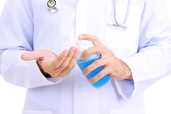 Medical doctor using sanitizer dispenser — Stock Photo, Image