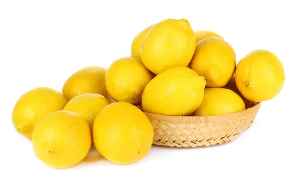 Ripe lemons in wicker basket isolated on white — Stock Photo, Image