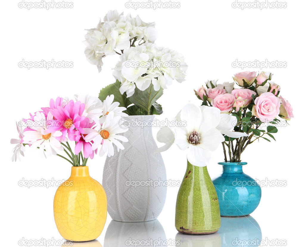 Beautiful flowers in vases isolated on white