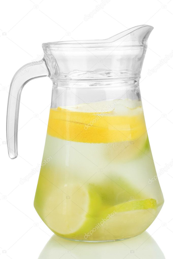 Cold water with lime, lemon and ice in pitcher isolated on white