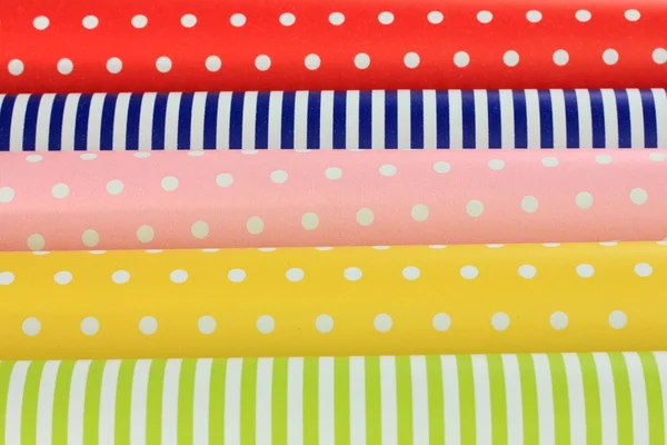 Color papers for wrapping gifts close-up background — Stock Photo, Image