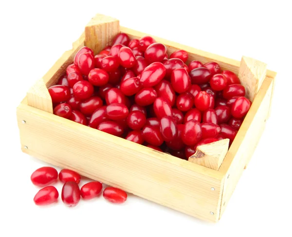 Fresh cornel berries in wooden crate, isolated on white — Stock Photo, Image