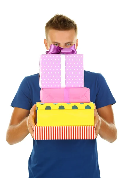 Young man holding gifts, isolated on white — Stock Photo, Image