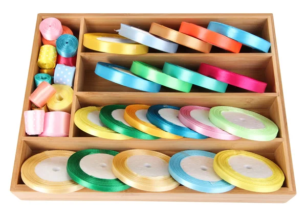 Bright silk ribbons in wooden box, isolated on white — Stock Photo, Image