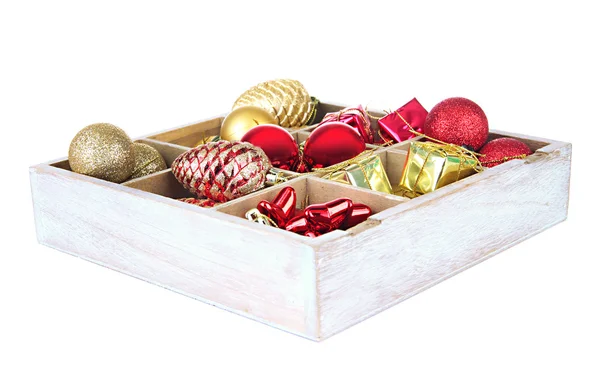 Wooden box filled with christmas decorations, isolated on white — Stock Photo, Image