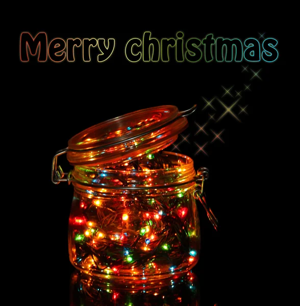 Karácsonyi fények üvegben sötét háttér — Stock Fotó