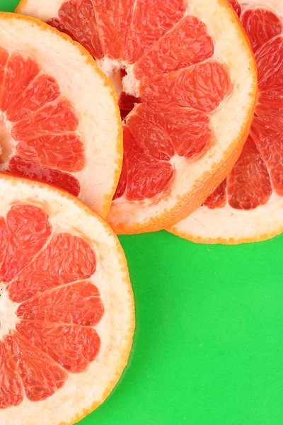 Grapefruit szeletek keret, háttér szín — Stock Fotó