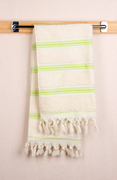Bath towel on crossbar in room — Stock Photo, Image