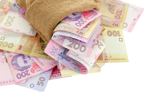 Jute zak met Oekraïense geld, geïsoleerd op wit — Stockfoto