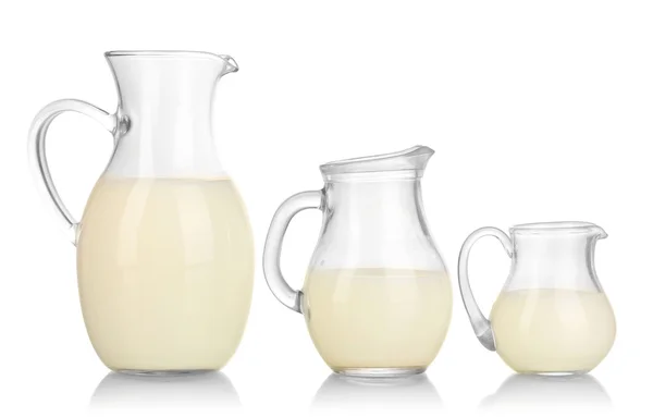 Milk in jugs isolated on white — Stock Photo, Image