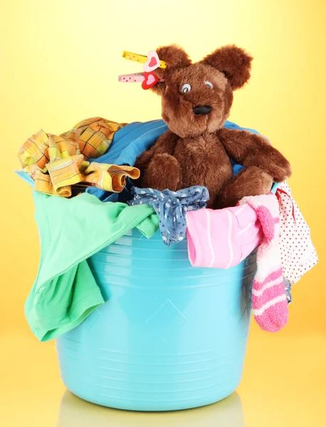 Blue laundry basket on orange background — Stock Photo, Image