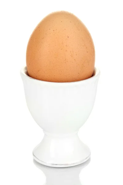 Whole boiled egg in egg cup isolated on white — Stock Photo, Image