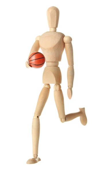 Деревянный манекен с баскетбольным мячом на сером фоне — стоковое фото
