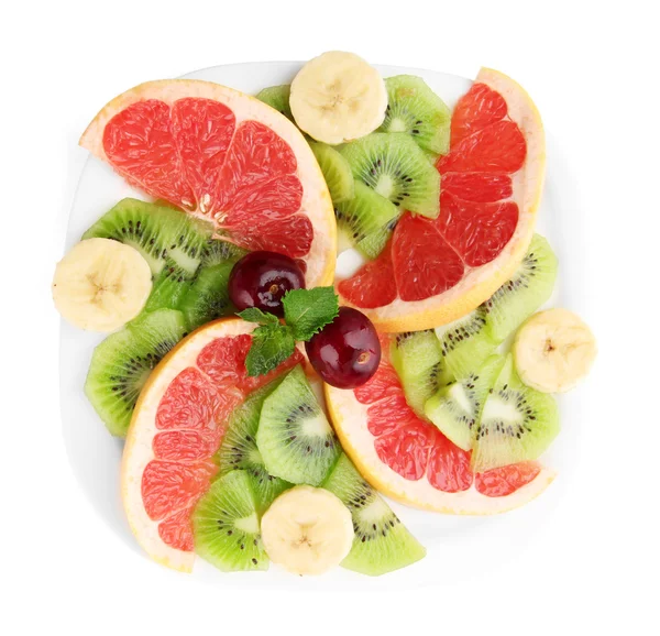 Assortment of sliced fruits on plate, isolated on white — Stock Photo, Image