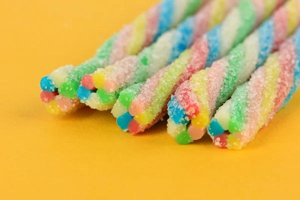 Sweet jelly candies on yellow background — Stock Photo, Image