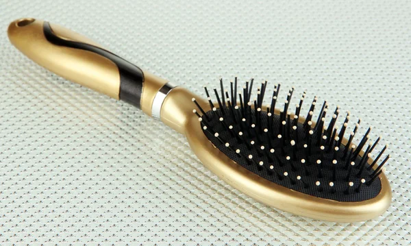 Hairbrush on color background — Stock Photo, Image