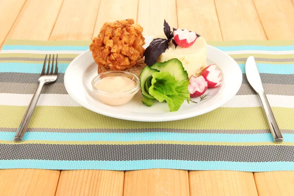 Chicken Kiev on croutons with mashed potatoes, on wooden background — Stock Photo, Image