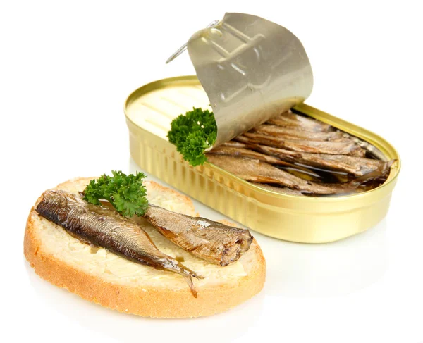 Open tin can with sardines and tasty sandwich, isolated on white — Stock Photo, Image