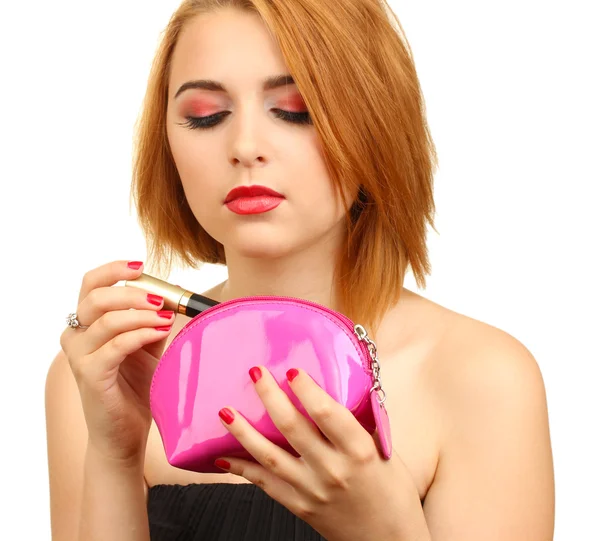 Piękna młoda kobieta z tusz do rzęs w torba na kosmetyki — Zdjęcie stockowe