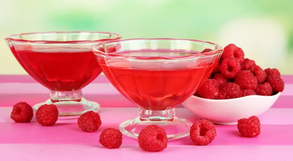 Jelly with fresh berries on pink wooden table — Stock Photo, Image