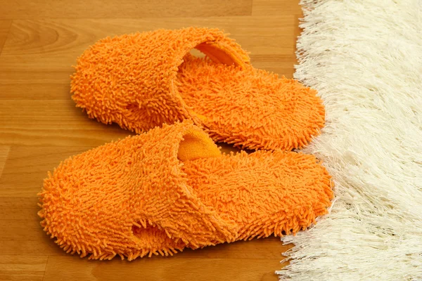 Bright slippers, on floor background — Stock Photo, Image