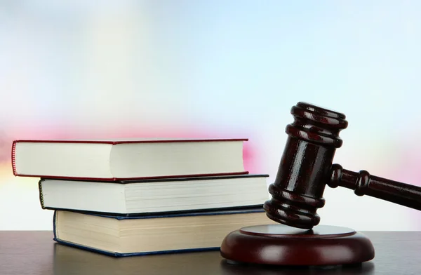 Gavel and books on table on light background — Stock Photo, Image