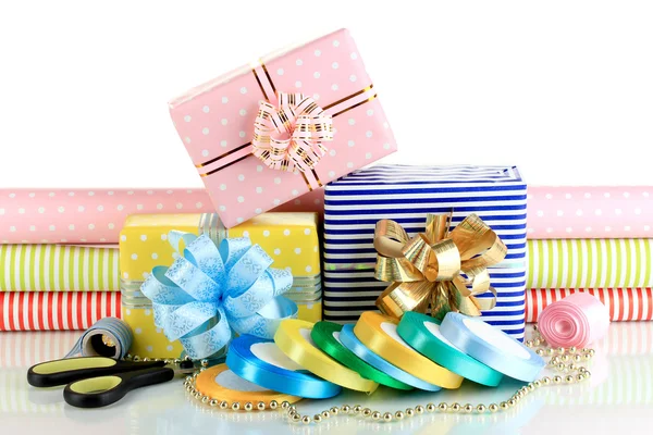 Materials and accessories for wrapping gifts with holiday gifts isolated on white — Stock Photo, Image