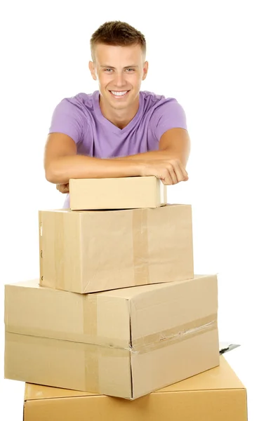 Young delivery man with parcels, isolated on white — Stock Photo, Image