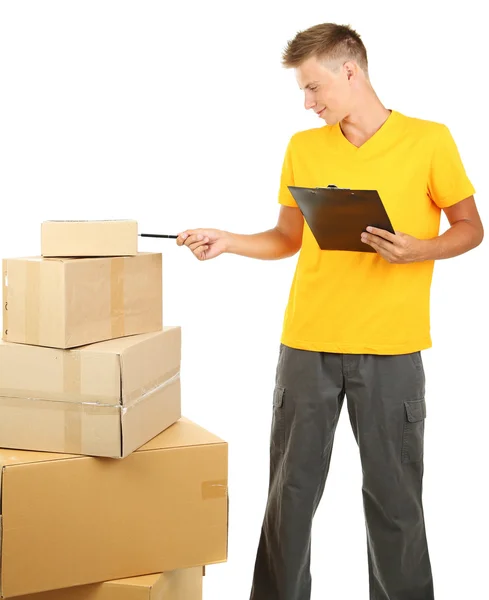 Young delivery man with parcels and clipboard, isolated on white — Stock Photo, Image