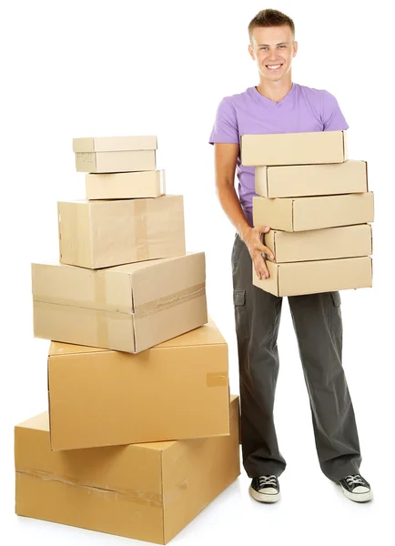 Young delivery man with parcels, isolated on white — Stock Photo, Image