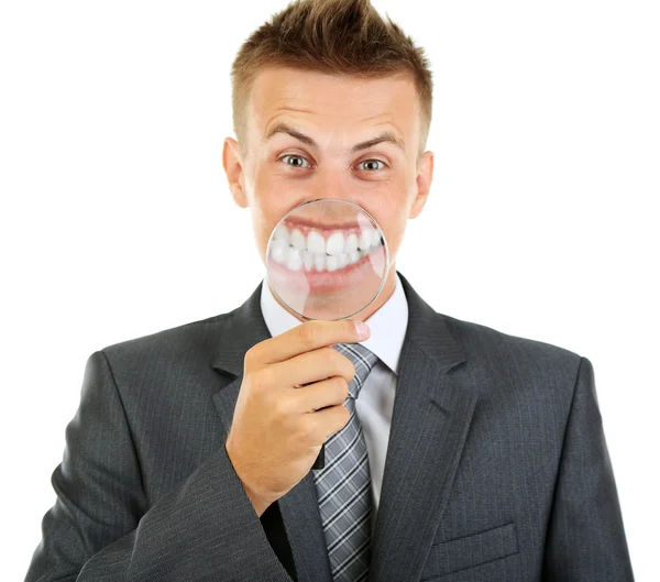 Uomo d'affari con lente d'ingrandimento zoom sul suo sorriso — Foto Stock