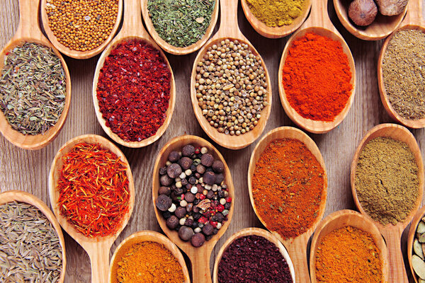 Assortment of spices in wooden spoons close-up