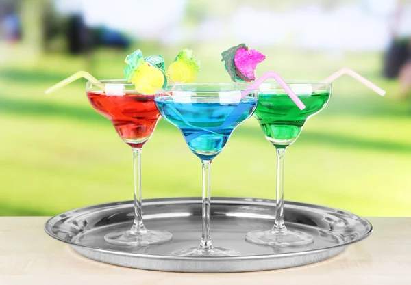 Different cocktails on bright background — Stock Photo, Image