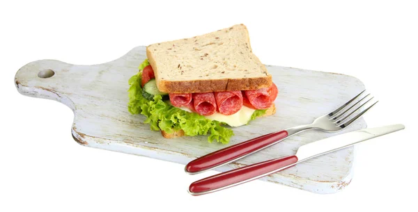 Tasty sandwich with salami sausage and vegetables on cutting board, isolated on white — Stock Photo, Image
