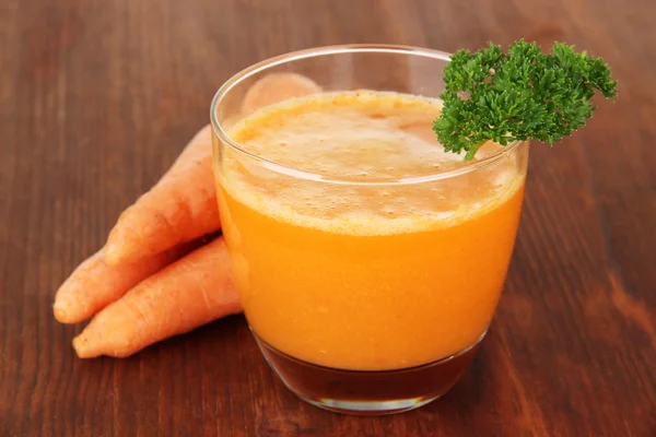 Fresh carrot juice on table close-up — Stock Photo, Image
