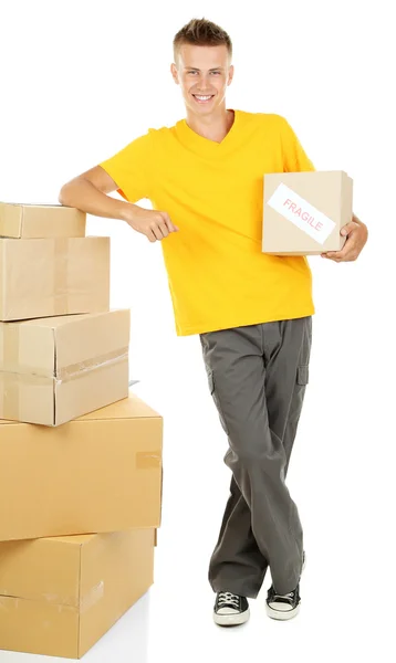 Young delivery man with parcels, isolated on white — Stock Photo, Image