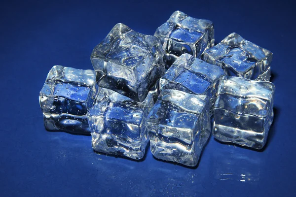 Ice cubes on color background — Stock Photo, Image