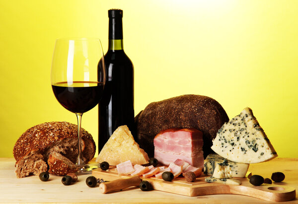 Exquisite still life of wine, cheese and meat products