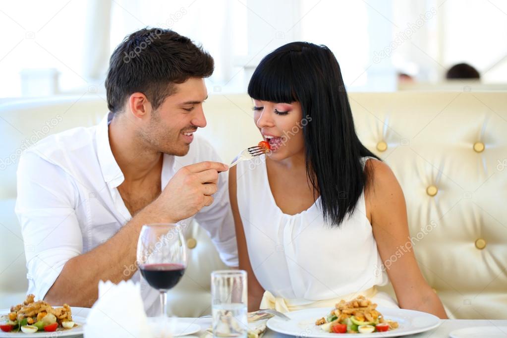 Beautiful couple having romantic dinner at restaurant