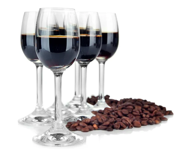 Glasses of liquor and coffee grains, isolated on white — Stock Photo, Image