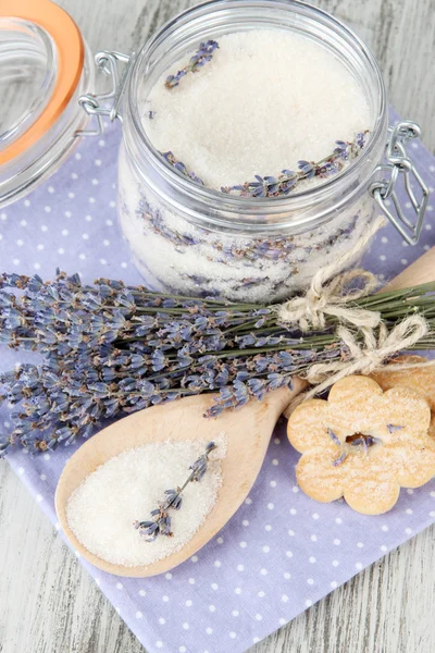 Jar of lavender sugar and fresh lavender flowers on wooden background — Stock Photo, Image