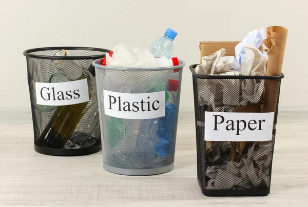 Three buckets of assorted debris on room background — Stock Photo, Image