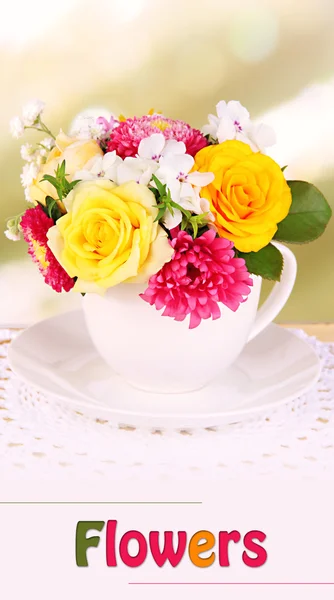 Beautiful bouquet of bright flowers in mug on bright background — Stock Photo, Image