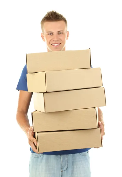 Jovem homem de entrega segurando parcelas, isolado em branco — Fotografia de Stock